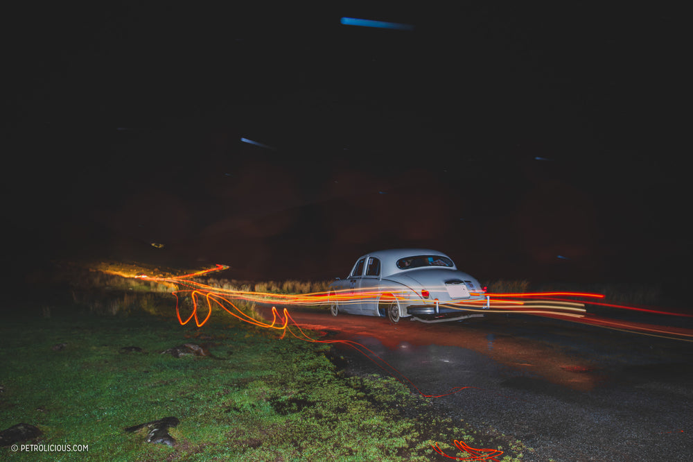 It's Not Every Night That One Gets To See Old Sports Cars Sling Mud Under A Starry Sky